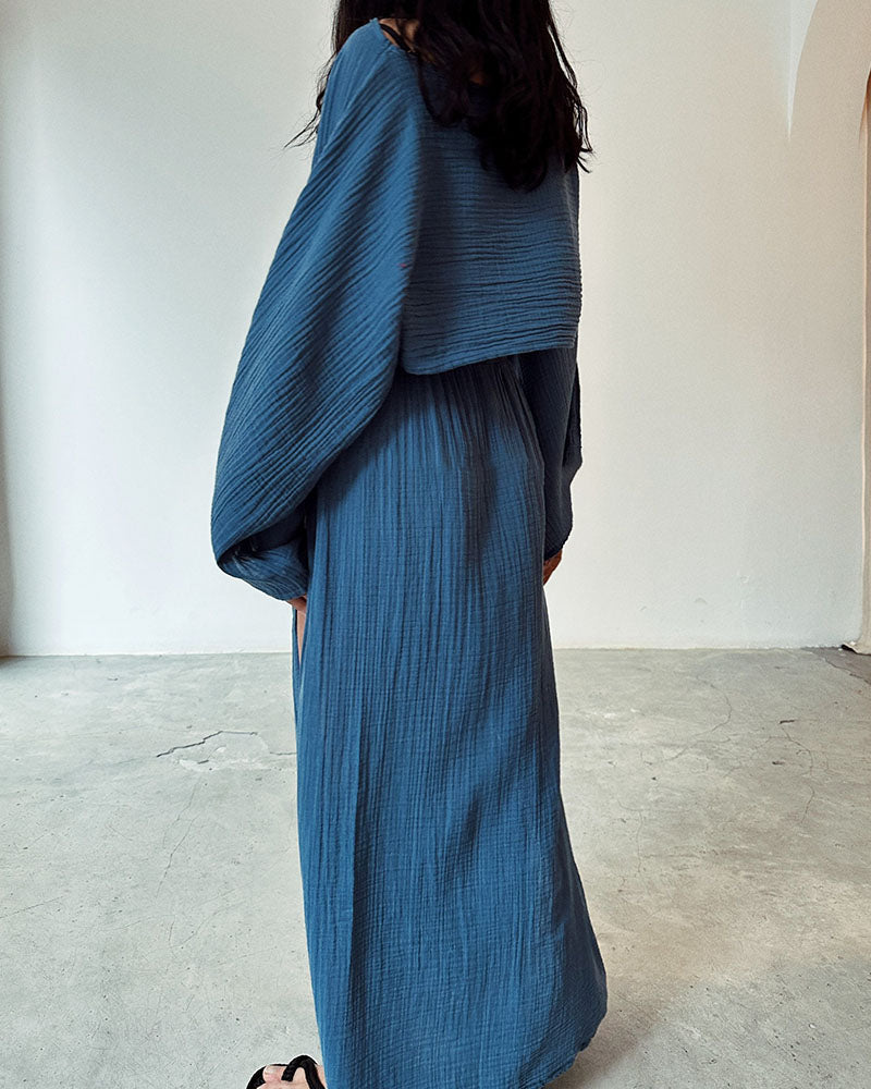 Women's two-piece crop top and side split maxi skirt set. Elegant long-sleeve co-ord, perfect for chic spring/autumn.