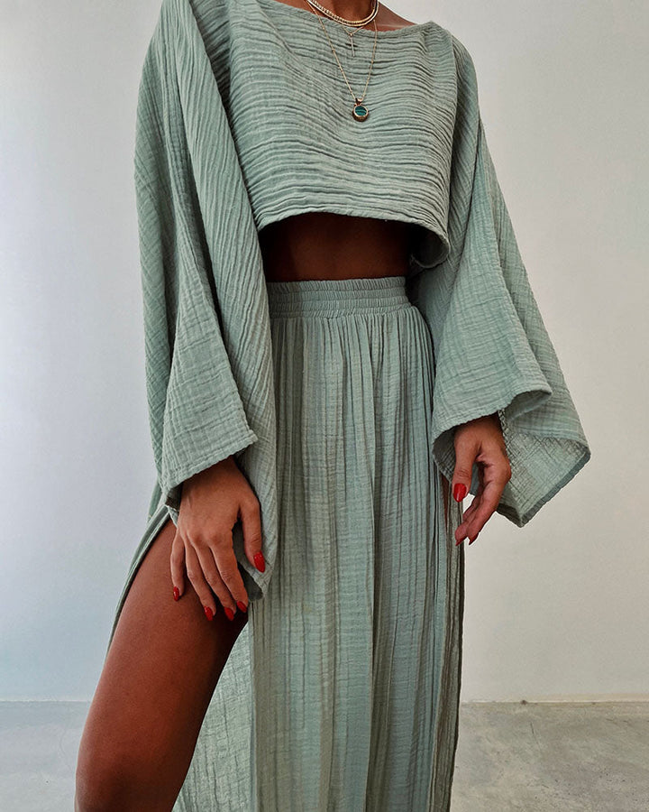 Stylish women's crop top & side split maxi skirt set. Versatile two-piece co-ord for spring, summer, autumn.