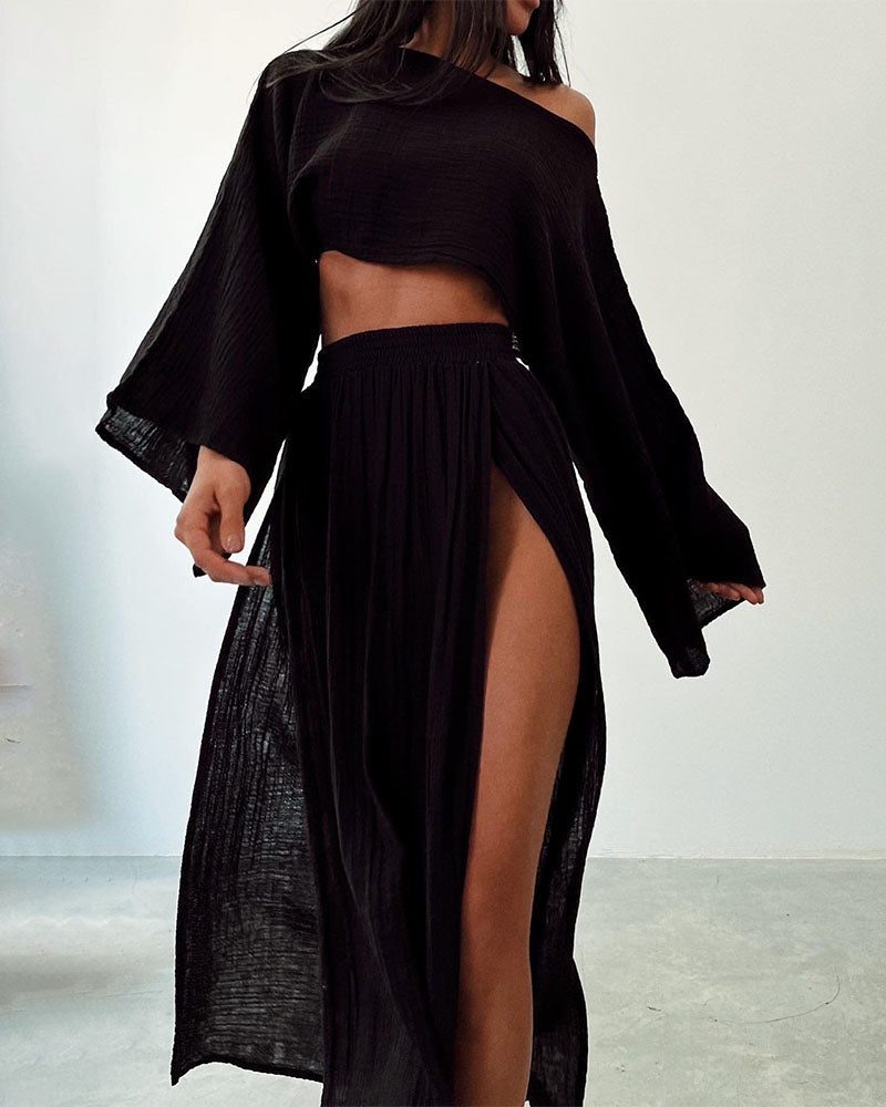 Women's stylish crop top & flowing side split maxi skirt set. Chic long sleeve two-piece outfit, versatile fashion.