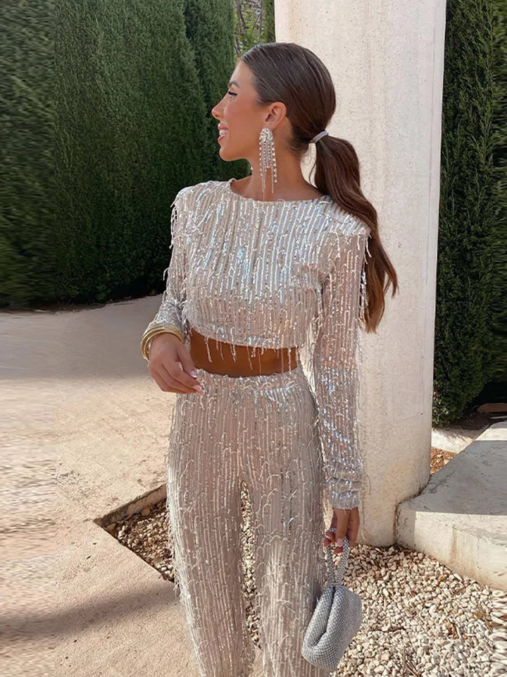 Glamorous women's sequin top & high-waist trousers two-piece set for evening wear.