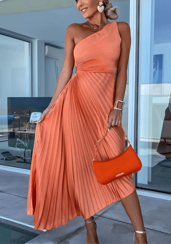 Stylish one-shoulder maxi dress with elegant pleats, a perfect women's fashion choice for evening events.