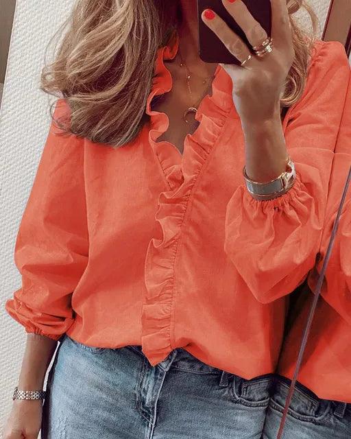 Beautiful women's ruffled long sleeve top, a versatile and elegant blouse for any occasion.