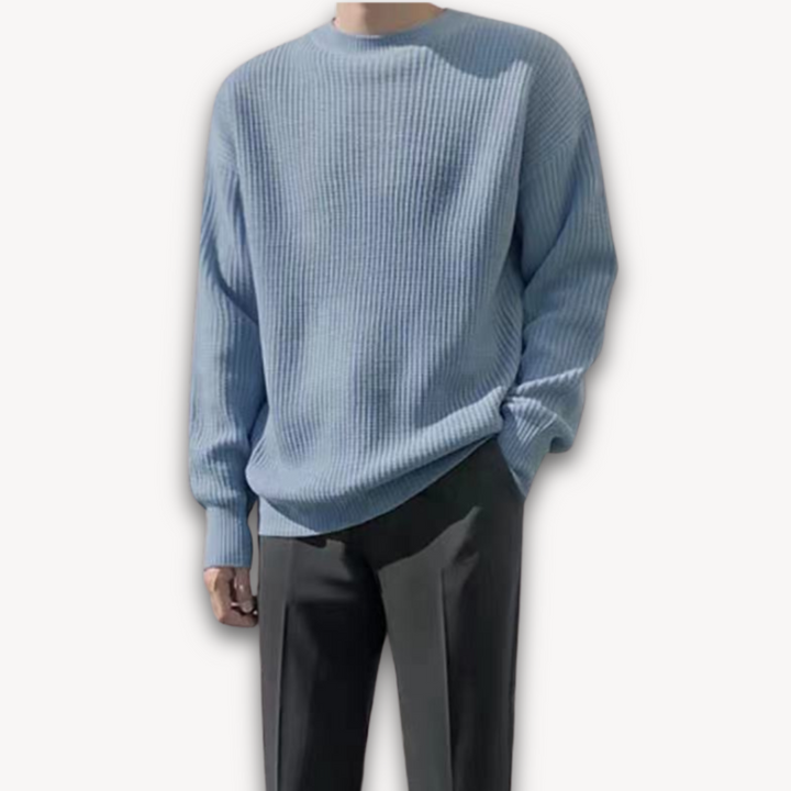 Dark green men's oversized knit sweater, soft acrylic, ribbed texture, cozy winter wear, casual elegance, warm menswear.