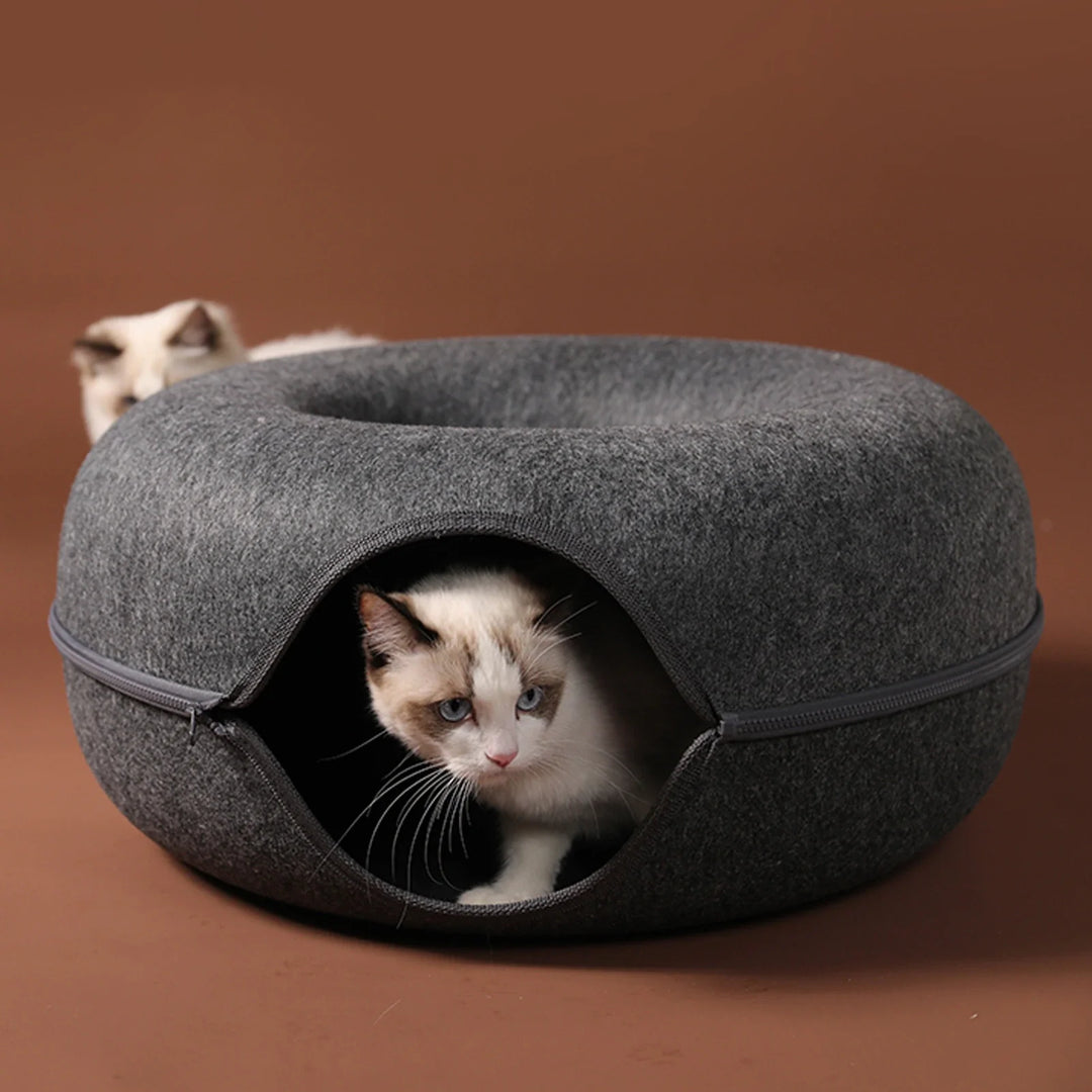 Dark grey felt cat donut cave bed, a cozy hideaway for a relaxing feline. Durable & washable pet tunnel.