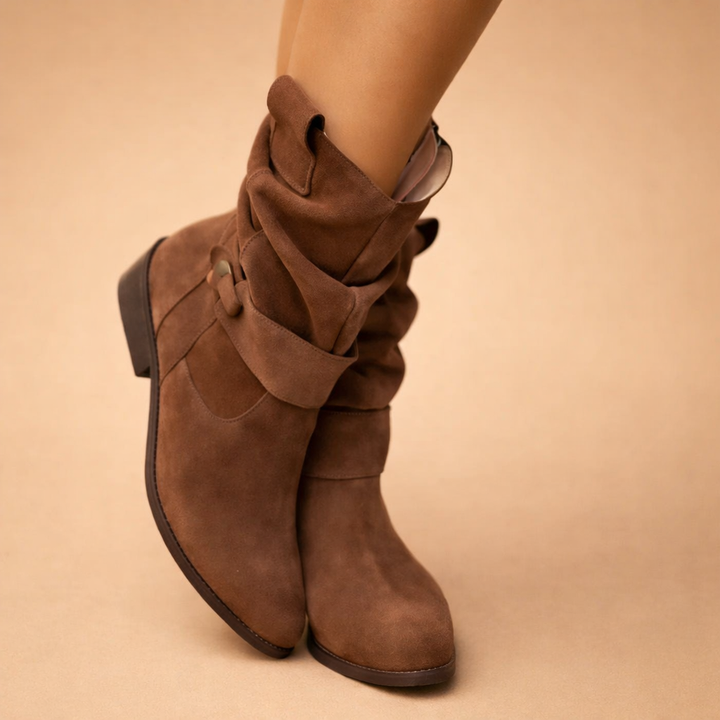 Women's fashionable slouchy ankle boots with a chic buckle, excellent for cozy fall and winter outfits.