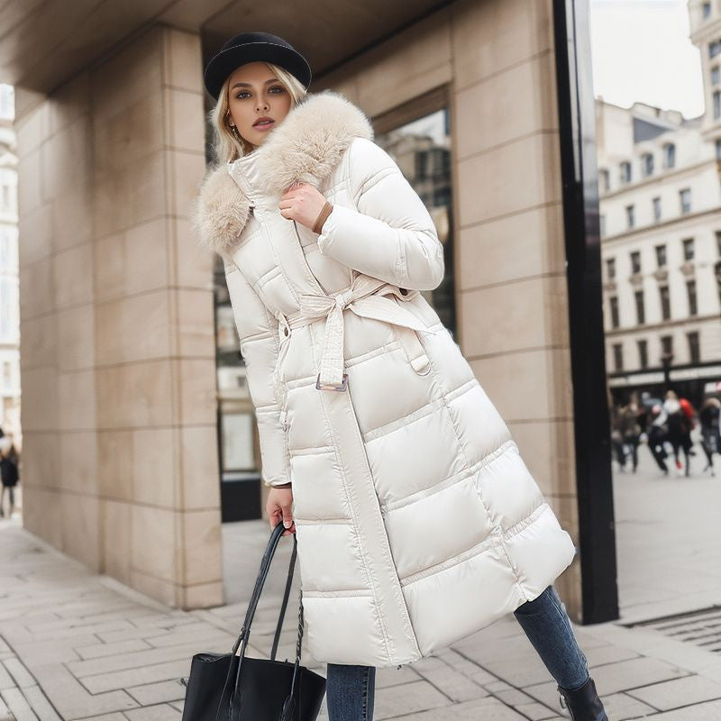 Sophisticated women's elegant winter coat. Ideal warm outerwear with a removable hood.