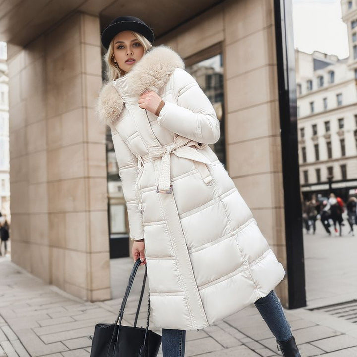 Sophisticated women's elegant winter coat. Ideal warm outerwear with a removable hood.