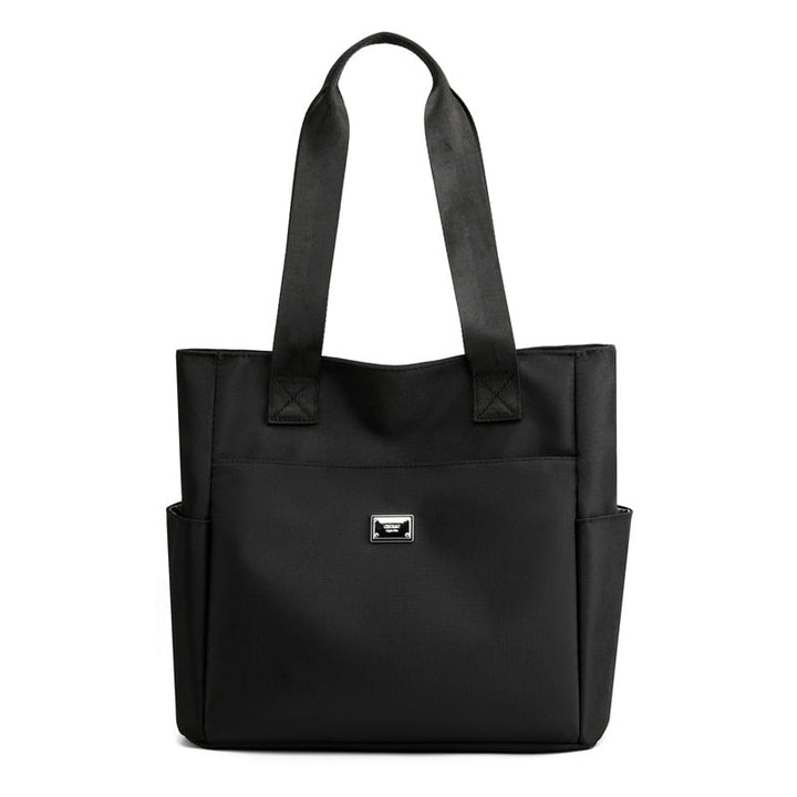 Side view of the women's lightweight waterproof shoulder bag, durable & travel-ready.