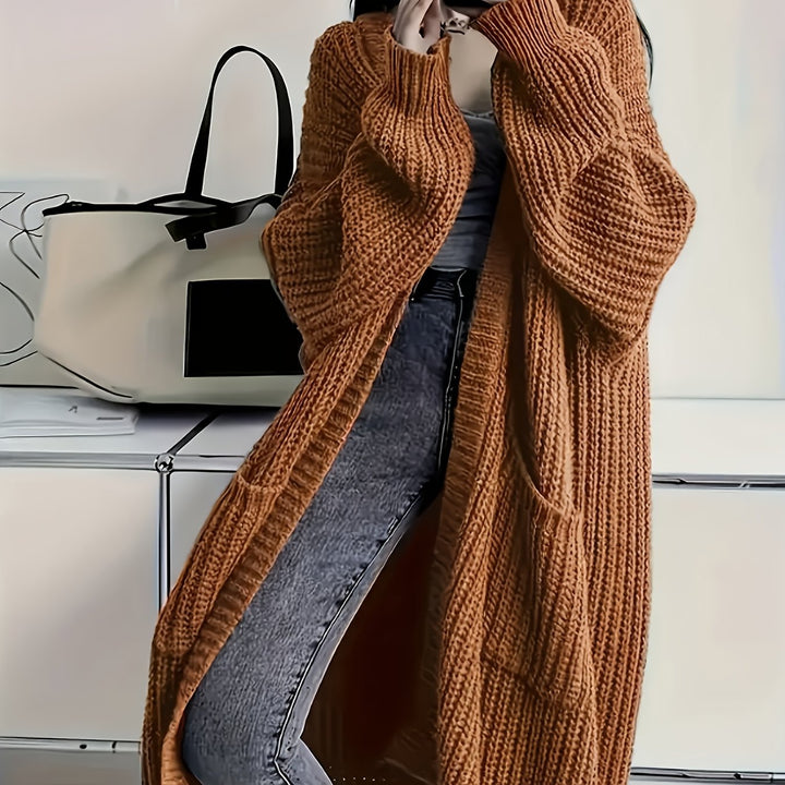 Women's cosy V-neck button-front cardigan sweater. Classic knitwear for a chic and warm style.