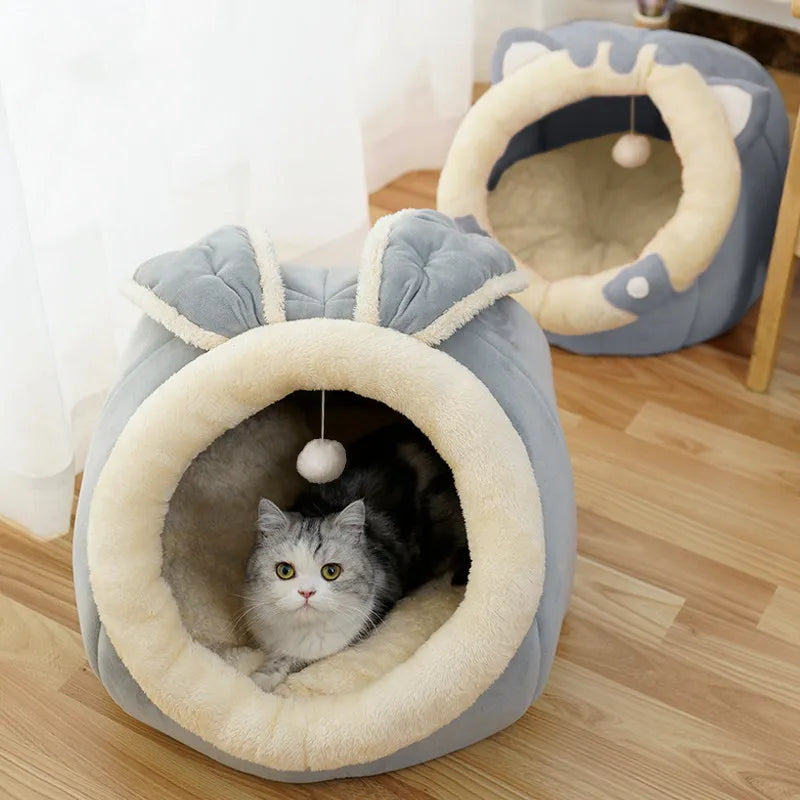 Plush cat cave bed with charming ear design. A soft snuggle retreat and cozy kitty haven among pet supplies.