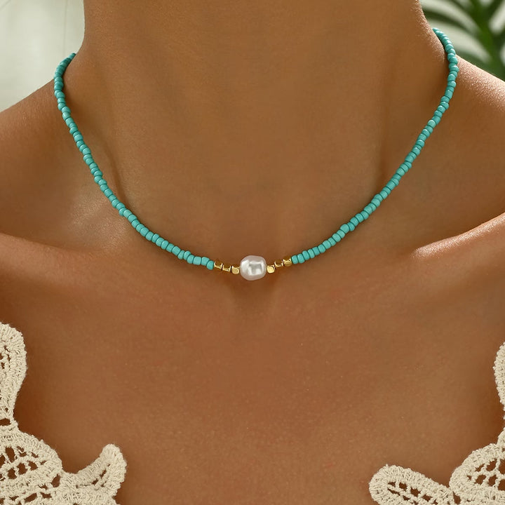 Minimalist women's necklace with delicate turquoise stone & lustrous white freshwater pearl. Elegant jewelry gift.