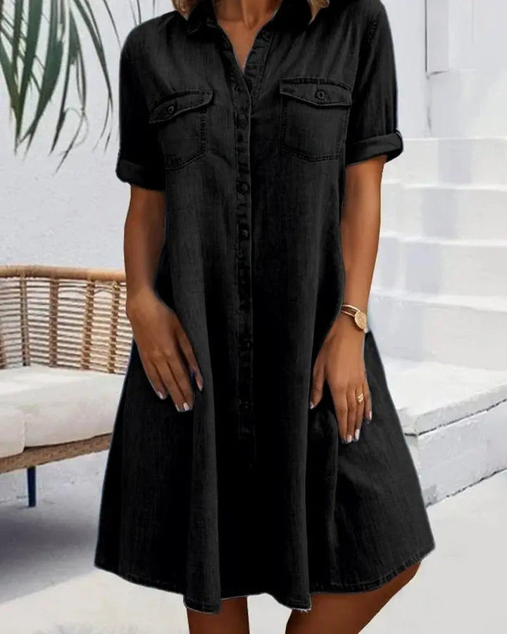 Chic women's denim shirt dress with button-down front & short sleeves. Comfortable, versatile everyday style.