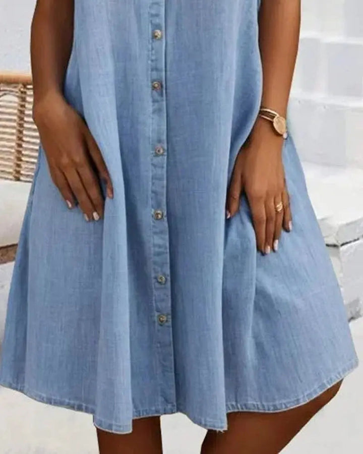Effortless women's denim shirt dress. Short sleeve, button-down, a versatile and comfortable everyday fashion piece.