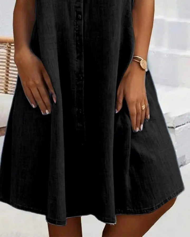 Women's button-down denim shirt dress with short sleeves. A versatile, chic, and comfortable everyday outfit.