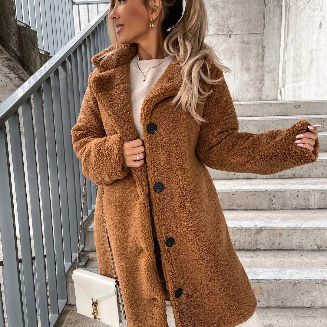 Elegant women's long plush winter coat, featuring an oversized fit and stylish button front closure.