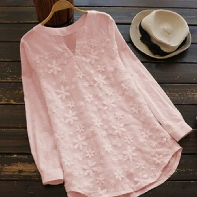 Chic blue long-sleeved women's top, offering elegant & versatile style for everyday outfits. All-season comfort.