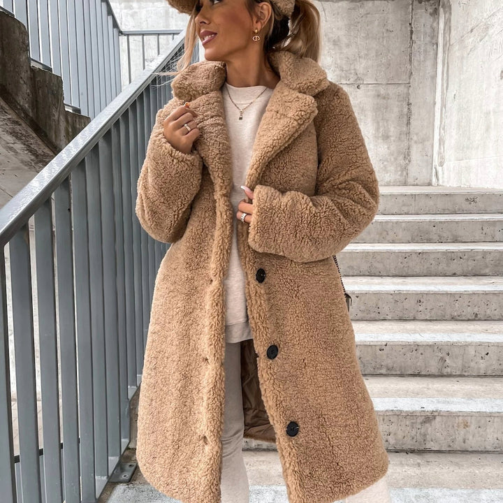 Women's oversized plush long winter coat, a cozy and warm jacket perfect for cold weather style.