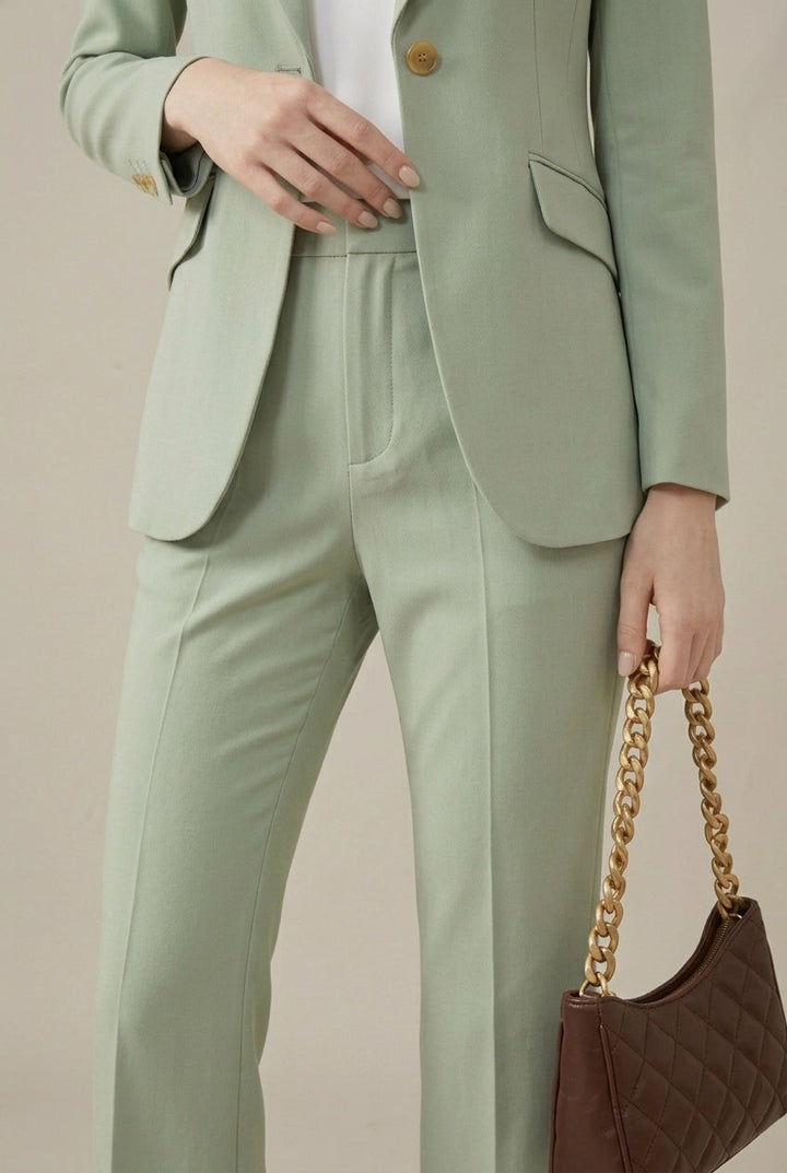 Chic women's two-piece tailored suit featuring a blazer with gold buttons & straight-leg pants.