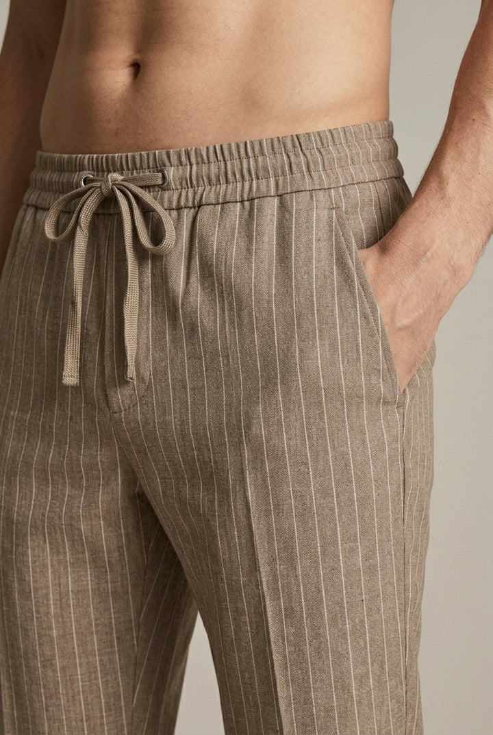 Stylish brown men's pinstripe tapered trousers, perfect smart casual spring summer workwear with an elastic waist.