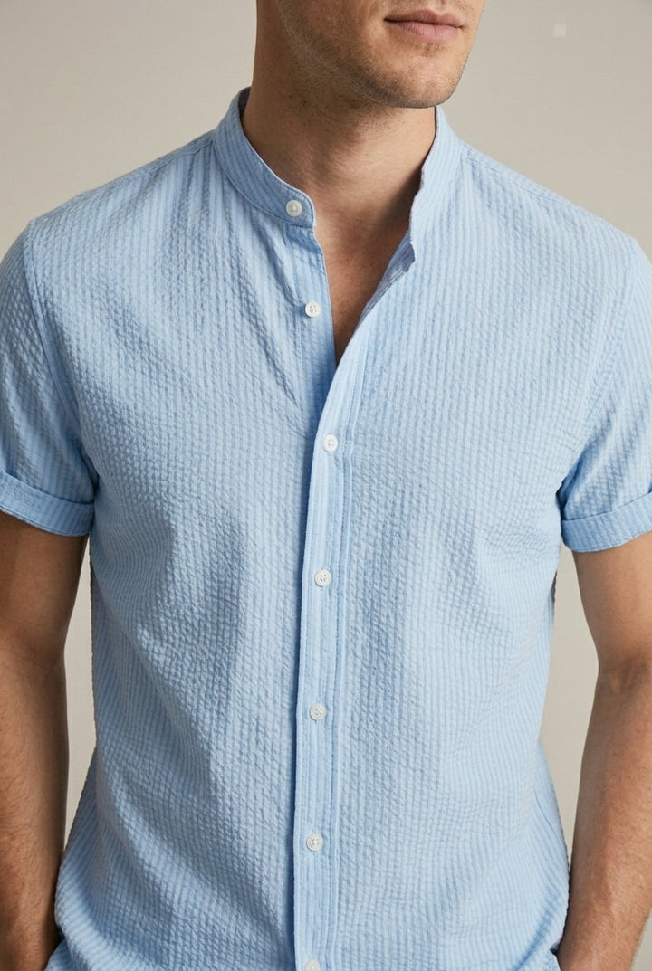 Loose fit men's textured short sleeve summer shirt with a band collar. Perfect casual button front for mens fashion.
