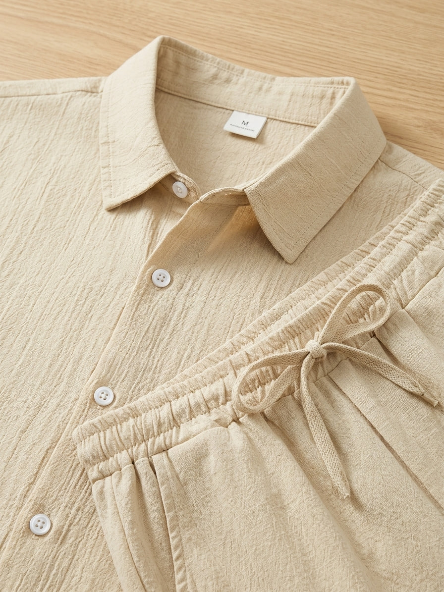 Versatile men's smart casual two-piece outfit. Coordinated textured shirt & drawstring trousers, ideal for spring/summer.