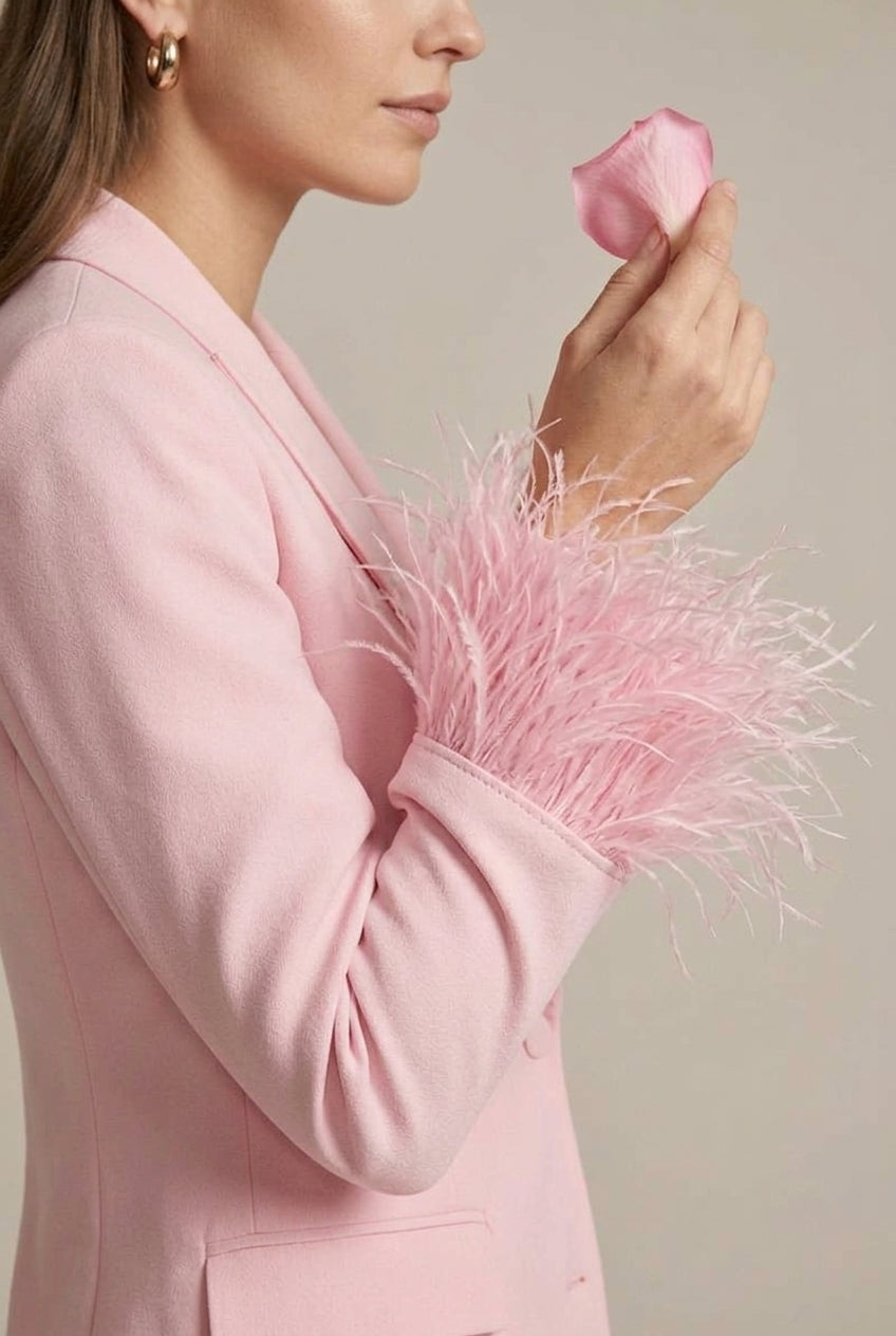 Stylish pink women's pant suit, featuring a feather cuff blazer & straight leg trousers. Ideal for occasion wear.
