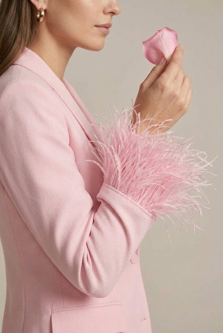 Stylish pink women's pant suit, featuring a feather cuff blazer & straight leg trousers. Ideal for occasion wear.