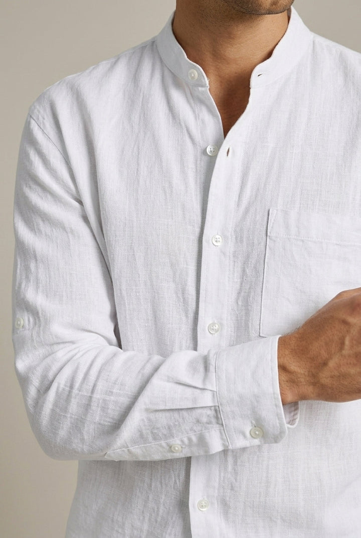 Stylish men's two-piece summer outfit featuring a relaxed band collar shirt and drawstring shorts.