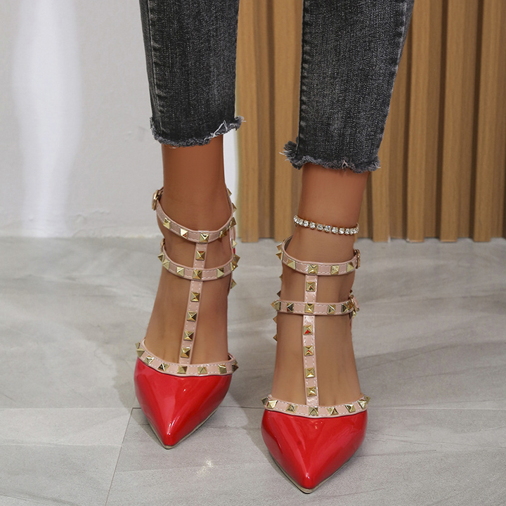 Stylish women's white studded pointed toe dress heels with an adjustable strap, perfect for events.