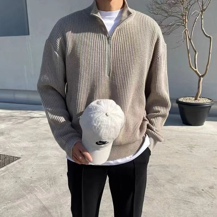 Casual men's long-sleeve quarter-zip sweater, a comfortable ribbed knit for layering and stylish everyday wear.
