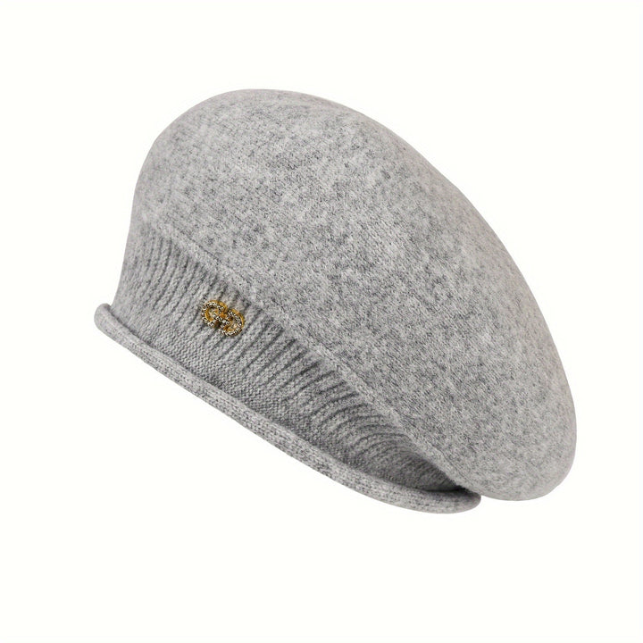 Classic women's knitted beret, an essential for elegant winter headwear and warmth.