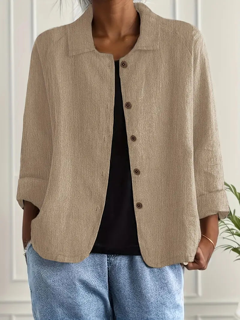 Chic women's collared blouse, button-down front & three-quarter sleeves. Ideal for work or everyday fashion.