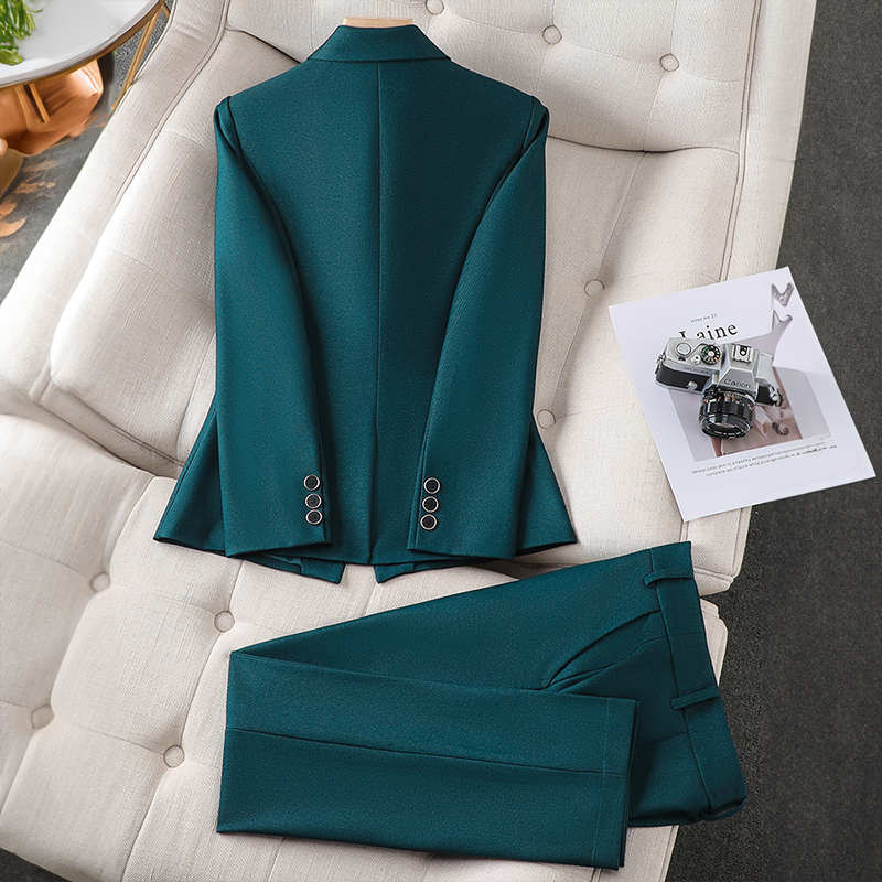 Stylish women's workwear ensemble. Fashionable blazer & sleek trousers create a chic, elegant office outfit.