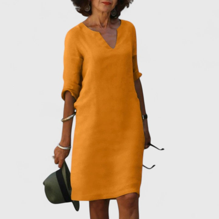Lightweight, comfortable women's V-neck summer midi dress for a relaxed, chic look.