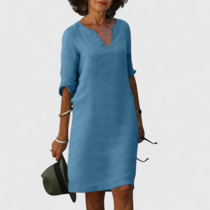 Relaxed fit women's V-neck midi dress, offering comfortable, versatile, and stylish casual wear.