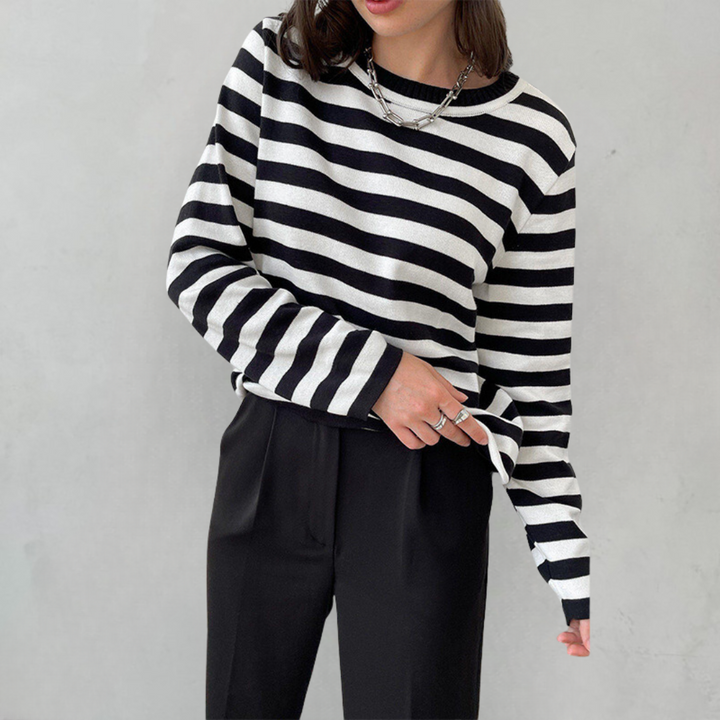 Elegant striped women's apparel, a comfortable round neck t-shirt, perfect for casual chic style.