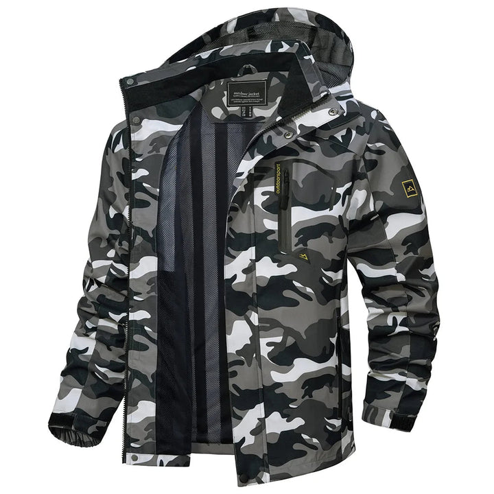 Men's lightweight hooded rain jacket in a forest setting, ideal for outdoor exploration & hiking.