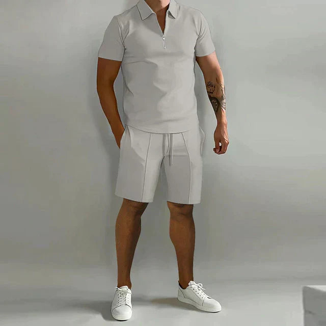 Man wearing a versatile men's fashion polo & shorts two-piece set, perfect for stylish summer wear.