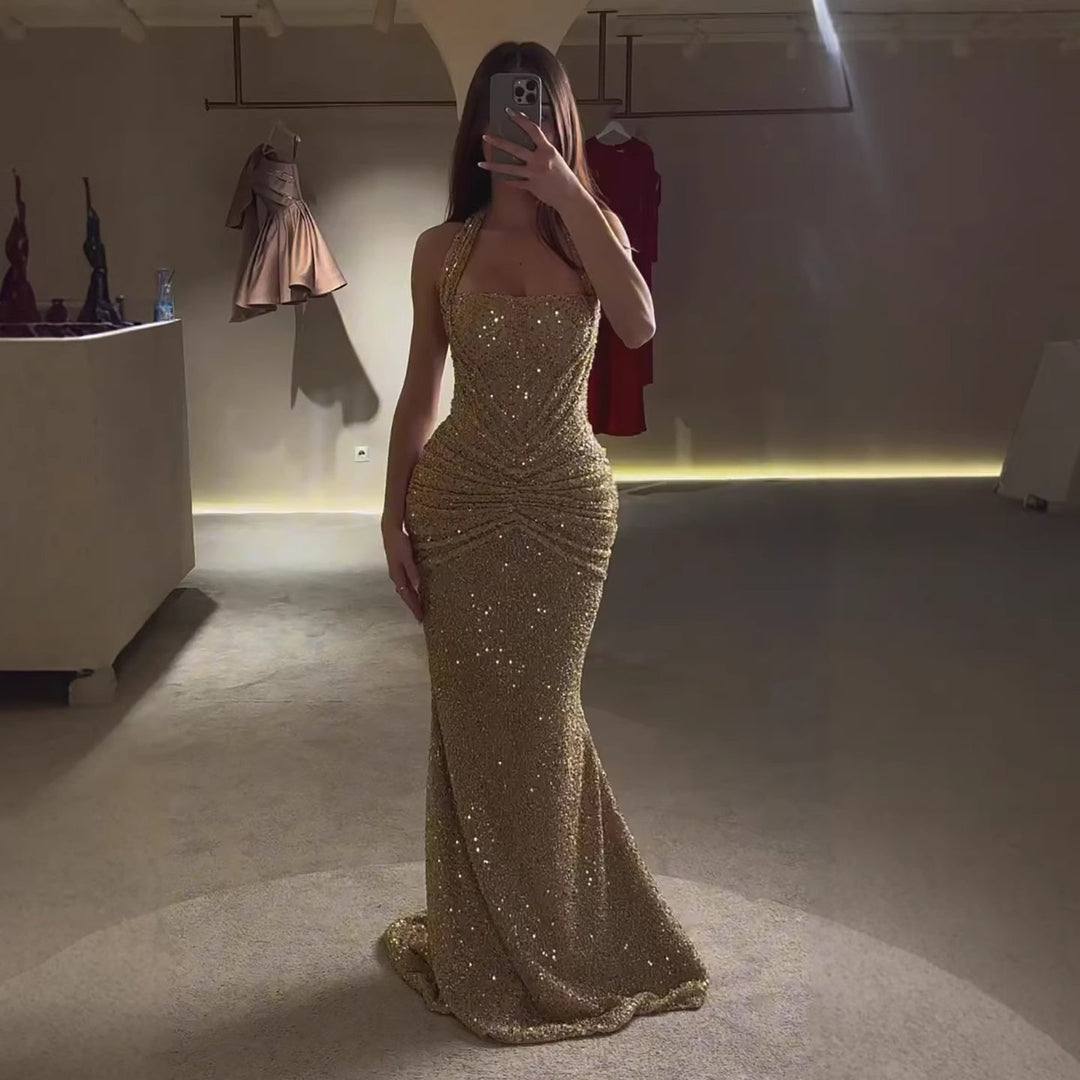 Shimmering gold maxi dress, a stylish women's halter evening gown. Perfect for elegant parties & summer special occasions.