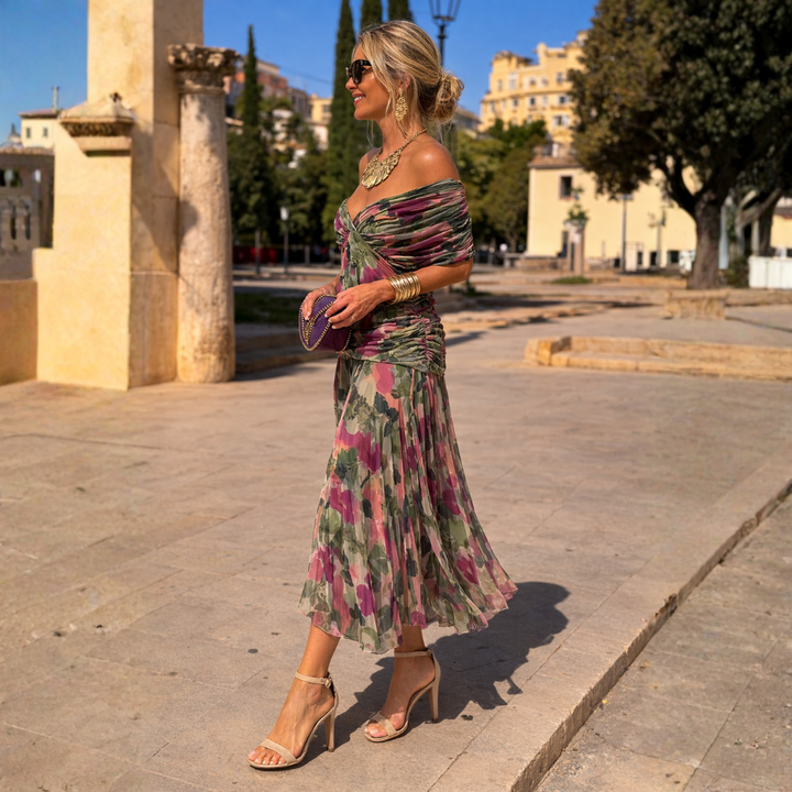 Women's bare-shoulder flowy long maxi dress, embodying effortless summer vacation style.