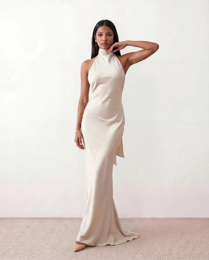 Elegant women's halter maxi dress with a flowing silhouette, perfect for summer evenings and resort wear.