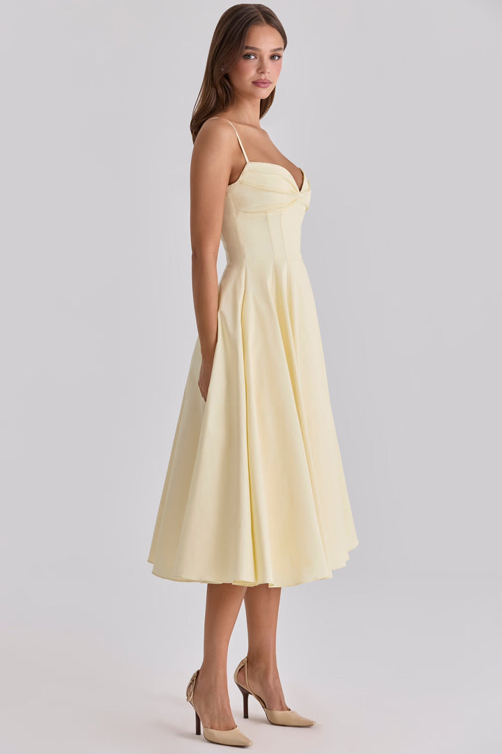 Flowy women's elegant midi dress featuring a gathered bust, suitable for both evening and day events.