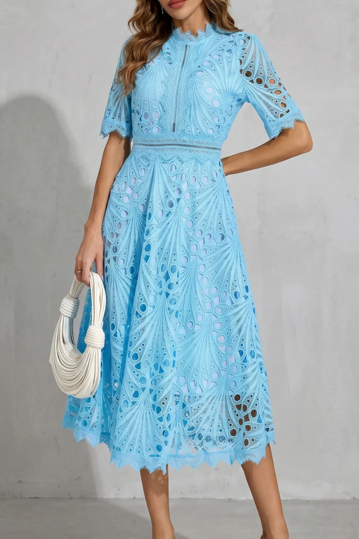 Light blue elegant midi dress for women, a comfortable and stylish summer wedding guest or cocktail party outfit.