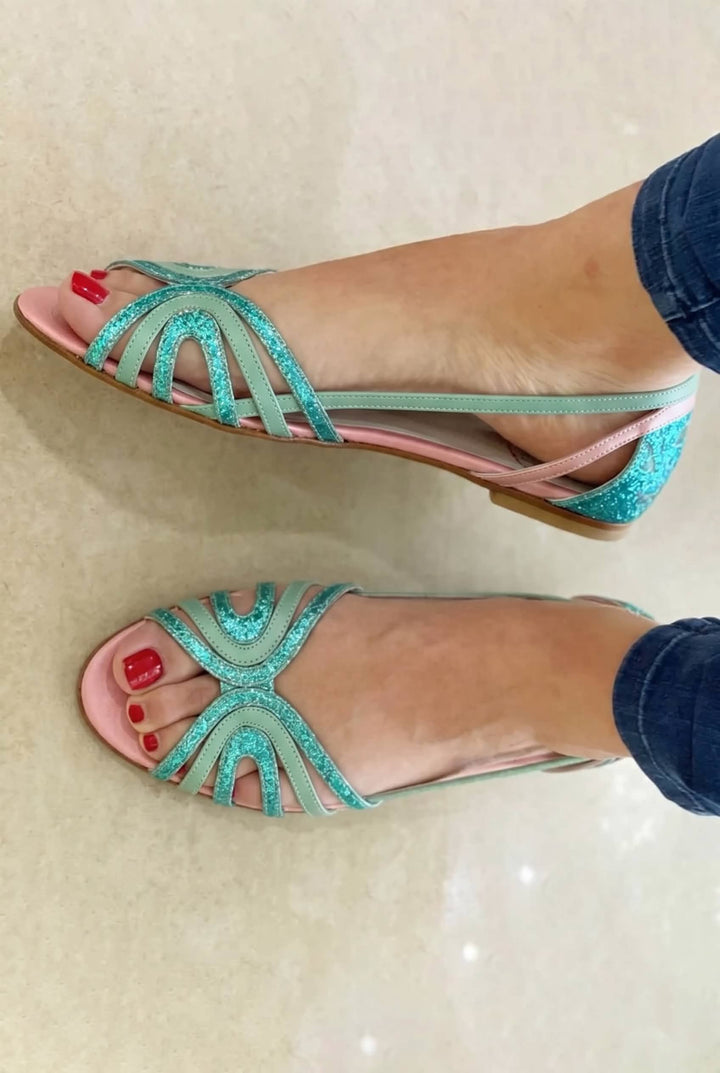 Open-toe, flat golden slip-on sandals for women, offering effortless comfort & a chic look for summer & holidays.