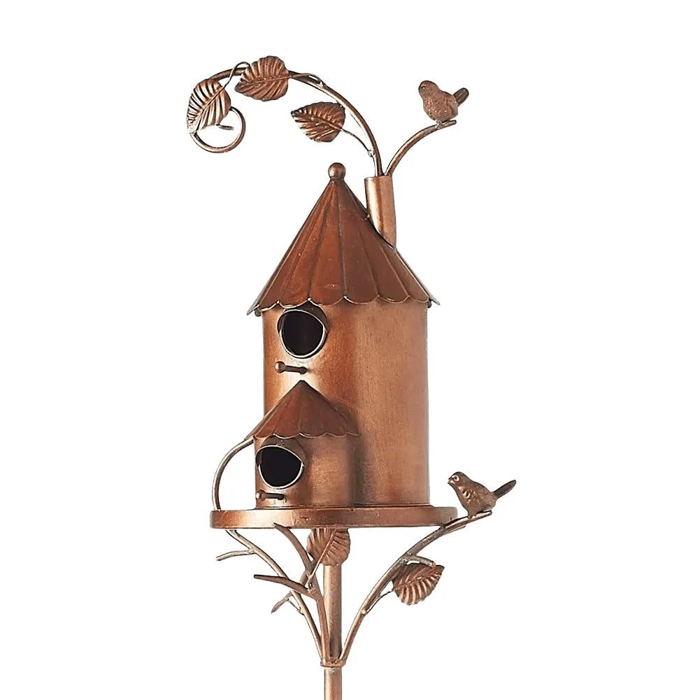 Rustic metal birdhouse, a charming garden accent for patio decor and outdoor living spaces.