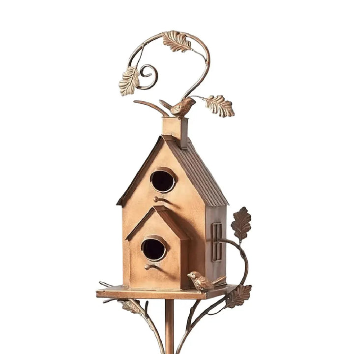 Elegant metal garden birdhouse, enhancing outdoor decor and creating a cozy bird home.