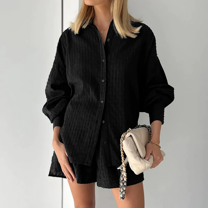 Stylish women's two-piece cotton blend outfit. Perfect for spring & summer casual wear, offering comfort & versatility.