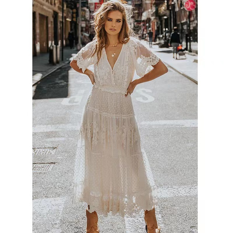 Elegant women's white lace maxi dress with short sleeves, perfect for summer occasions and chic wear.