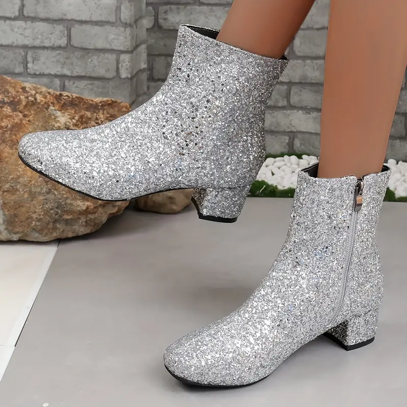 Sparkling women's fashion ankle boots, featuring a shimmering finish and sturdy block heel for elegant evening attire.