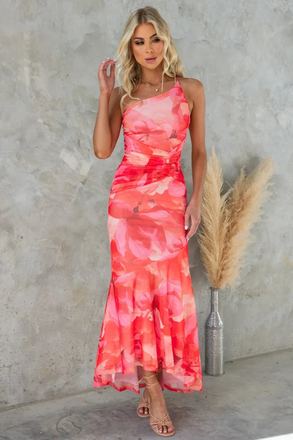 Flowy elegant midi dress for women featuring a colorful floral print, ideal for warm weather occasions.